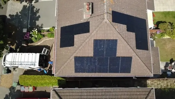 Aerial view of a house roof with a new solar panel installation